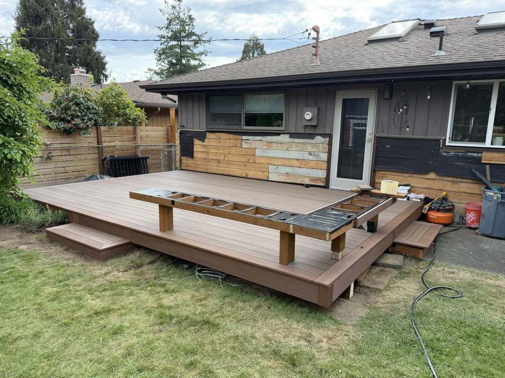 The bench frame under construction on the finished deck surface.