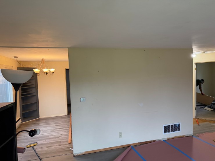 Wall patched after removing the load-bearing wall and installing a structural beam to open up the Burien floor plan