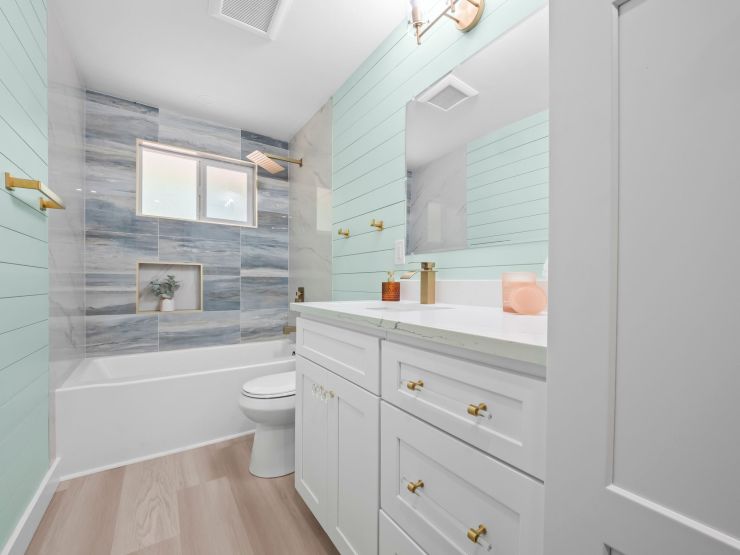 The same Tacoma bathroom tub and window finished with new tile and fixtures